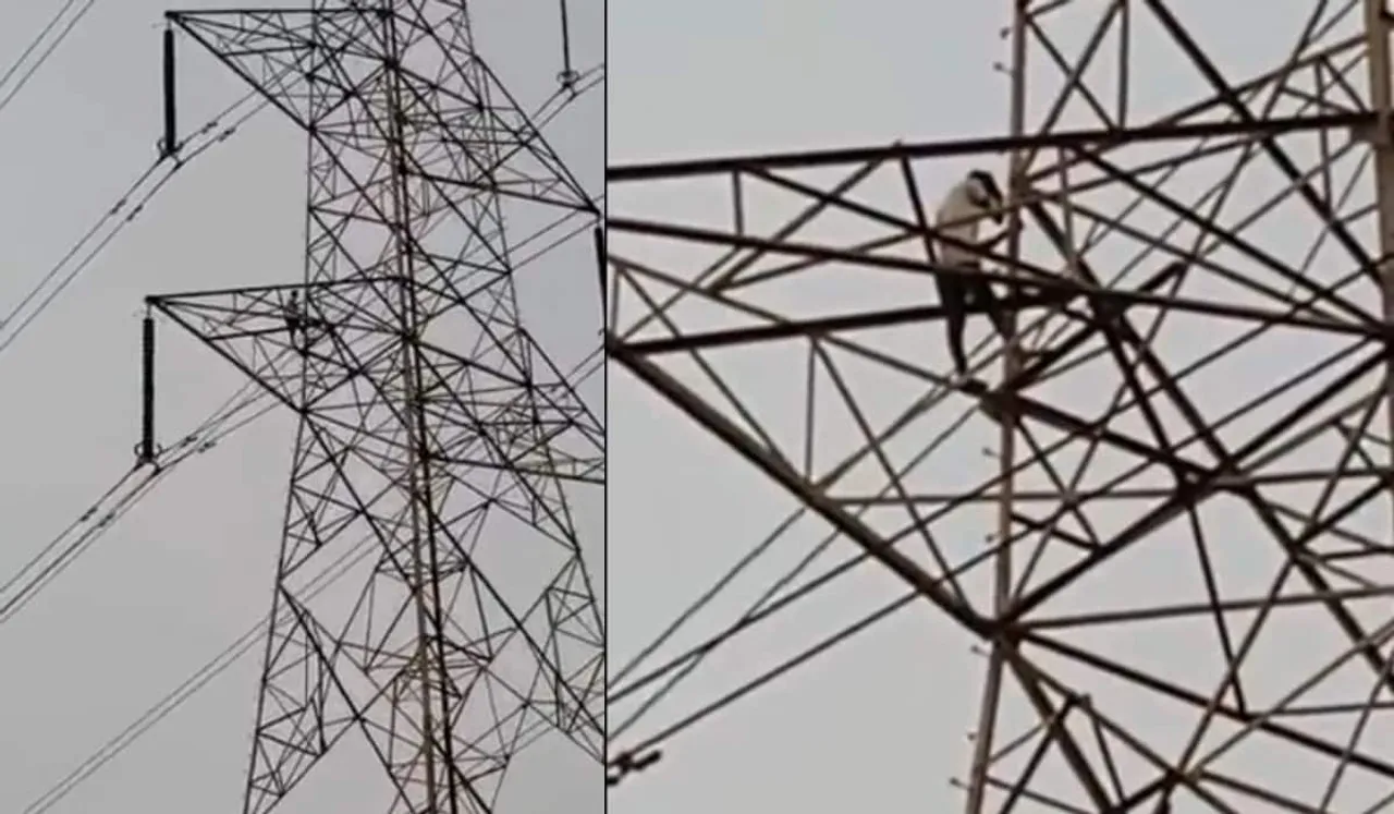Man Climbs Electric Tower