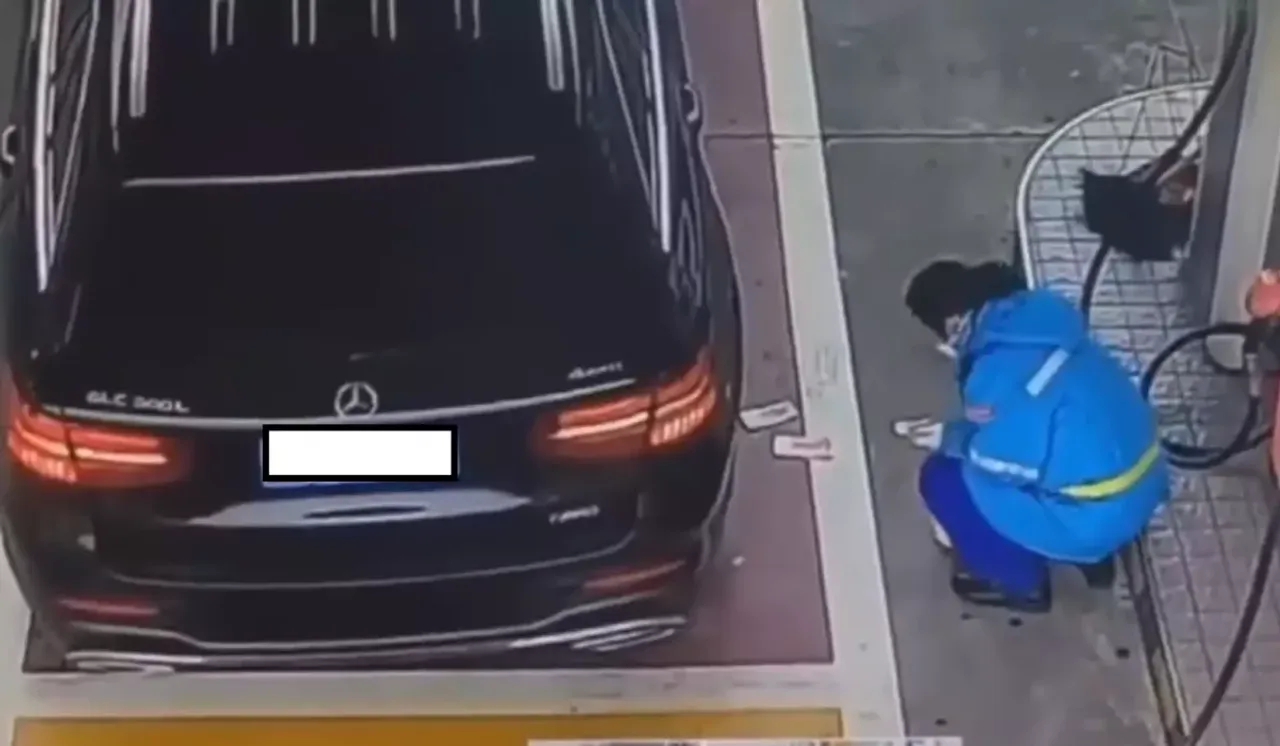 Car Owner Throws Money On Female Attendant