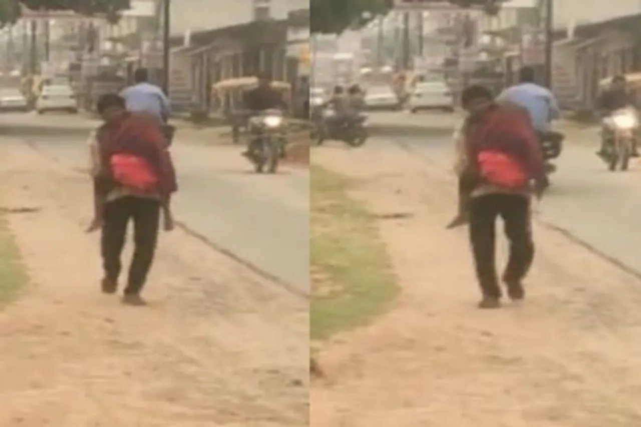 Father carries body of daughter