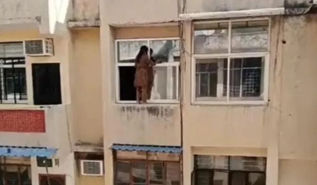 woman cleaning window viral video