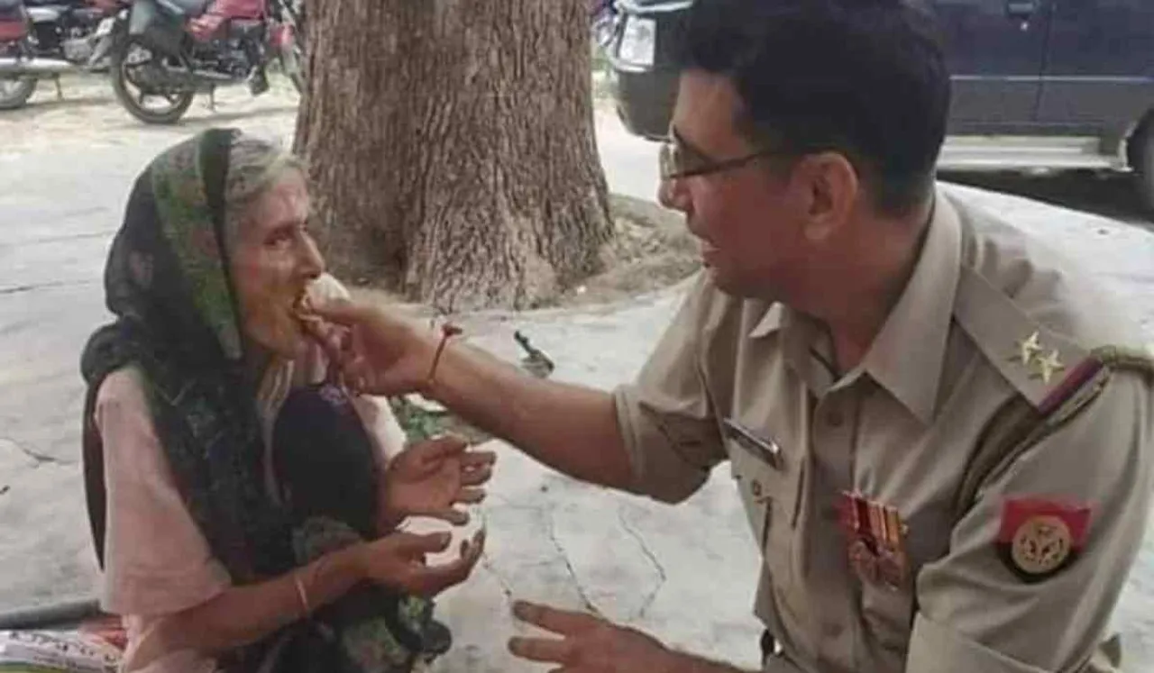 cop feeds old woman