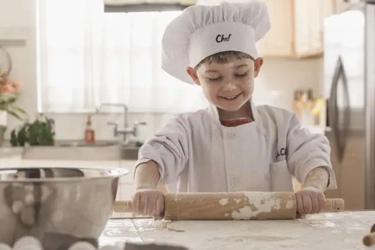 Boys in the kitchen : He will feed himself when no one is around!