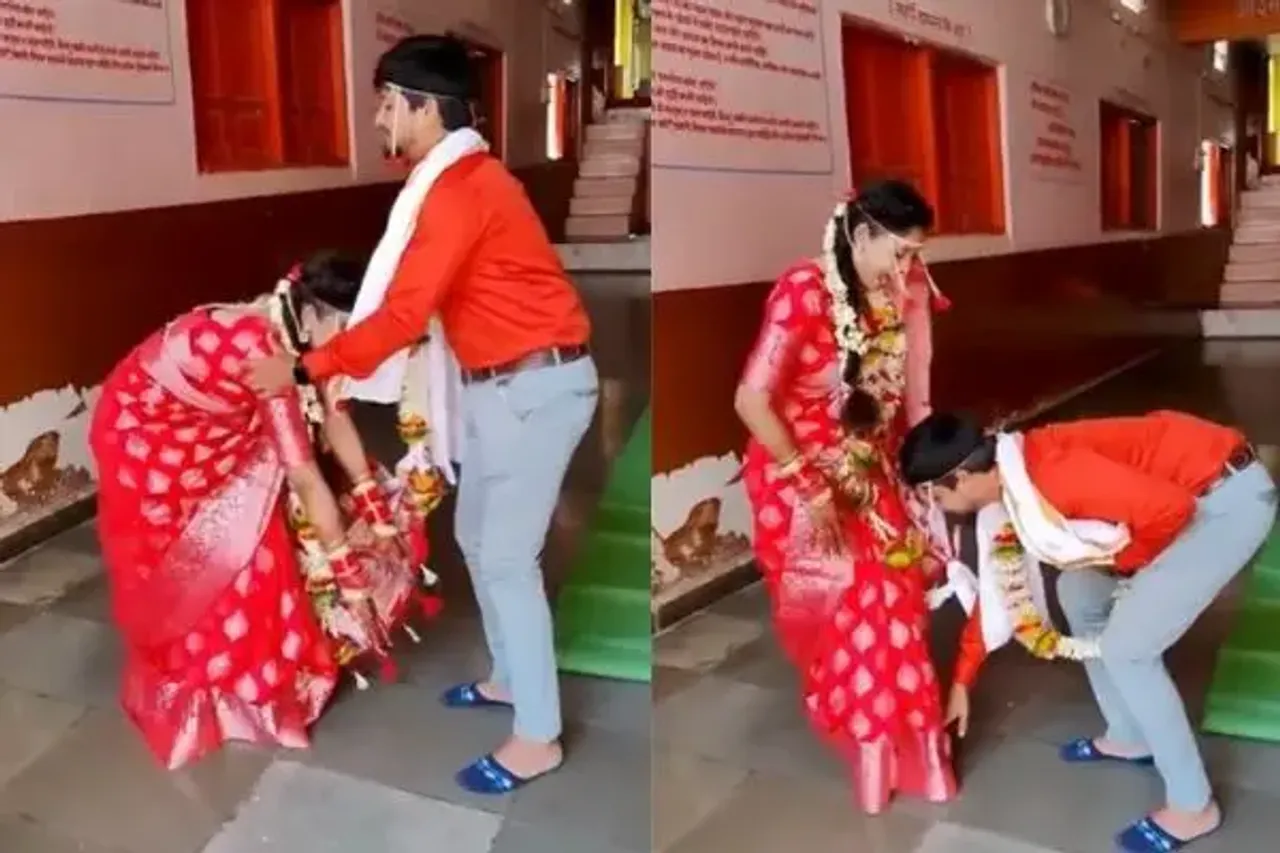 Groom touches bride feet