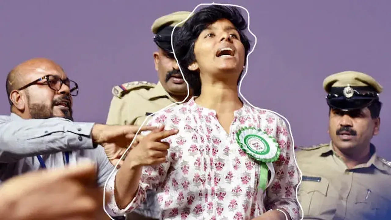 Karnataka, Feb 20 (ANI): The woman named Amulya being stopped by the organizers and police after she raised slogans during a protest rally against CAA by AIMIM Chief Asaduddin Owaisi at Freedom Park in Bengaluru on Thursday. (ANI Photo)