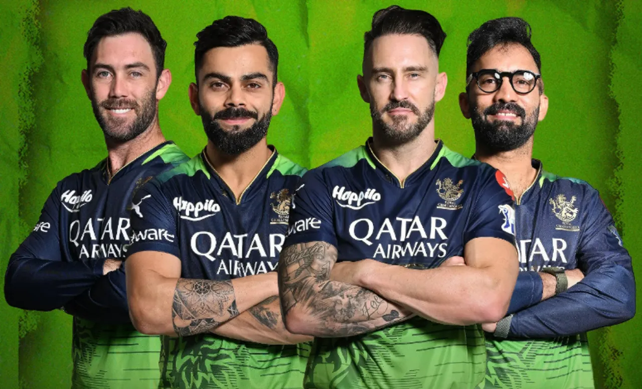 RCB players wearing Green Jersey