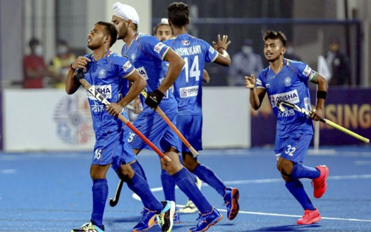 Indian players greet each other after a goal against Canada (in red) during FIH men's Junior World Cup (hockey) 2021 match at Kalinga Stadium in Bhubaneswar (PTI)