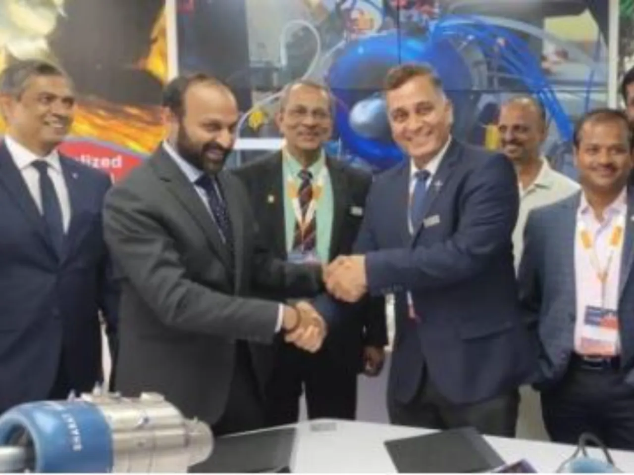 Guru Biswal, CEO Aerospace at Bharat Forge Ltd and Dipesh Gupta MD VEDA Aeronautics sign MoU for Made in India Unmanned Systems at at Aero India 2025 (2).JPG