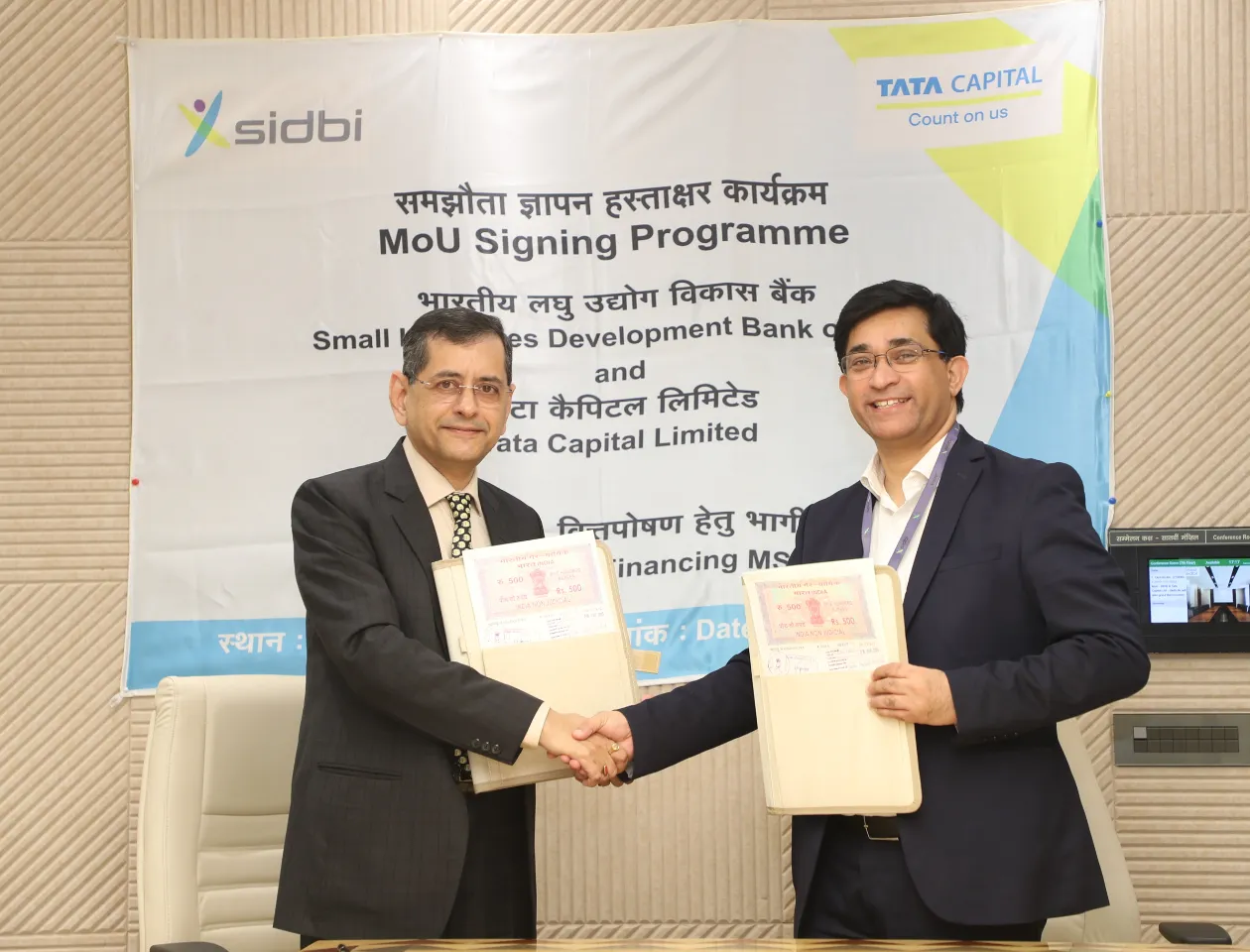 L to R - Shri Vivek Kumar Malhotra, Chief General Manager, SIDBI and Shri Vivek Chopra, Chief Operating Officer, Retail Finance, TCL.JPG