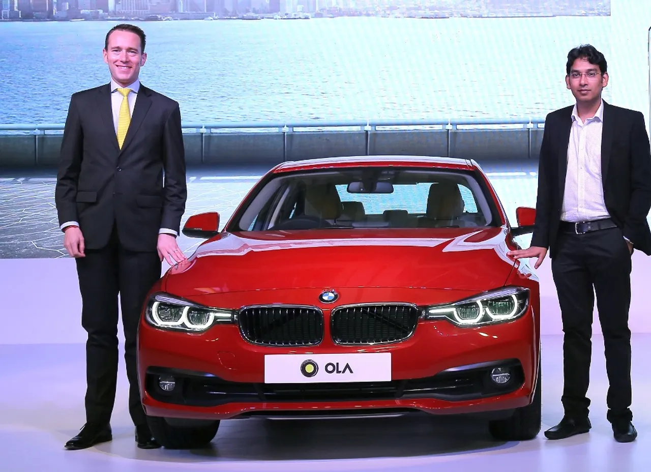 (L-R) Frank Schloeder - President (act.) BMW India & Pranay Jivrajka - COO, Ola