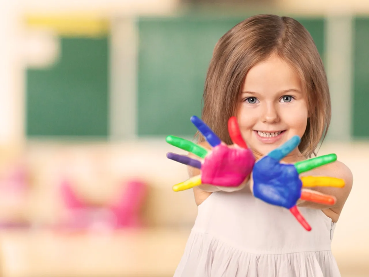 Child with coloured hands