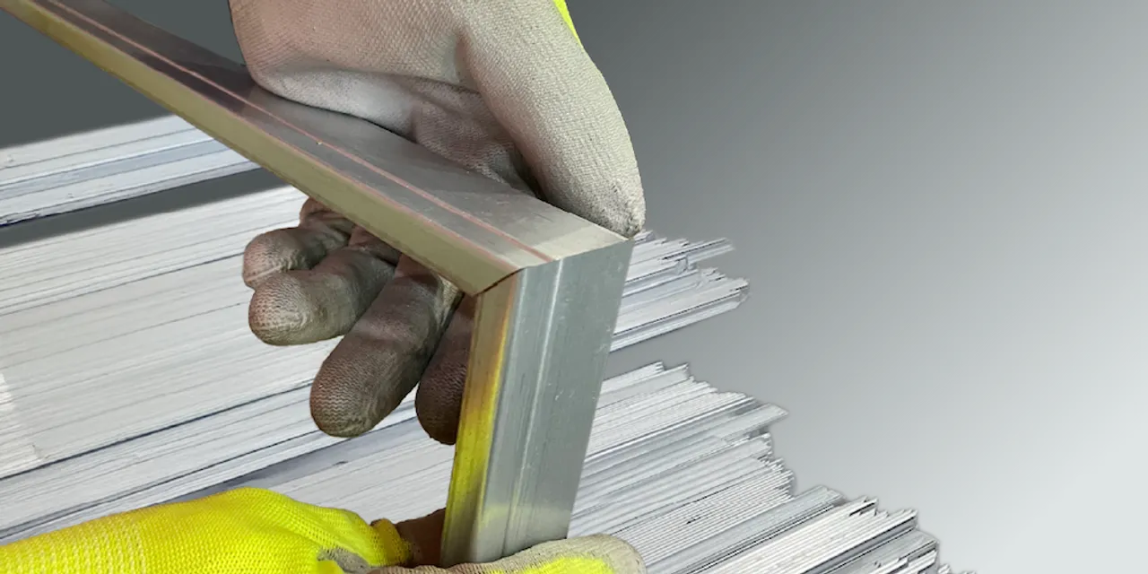 The new automated system transforms steel coils into complete solar frames, integrating custom lengths, hole punching, and corner key insertion. 