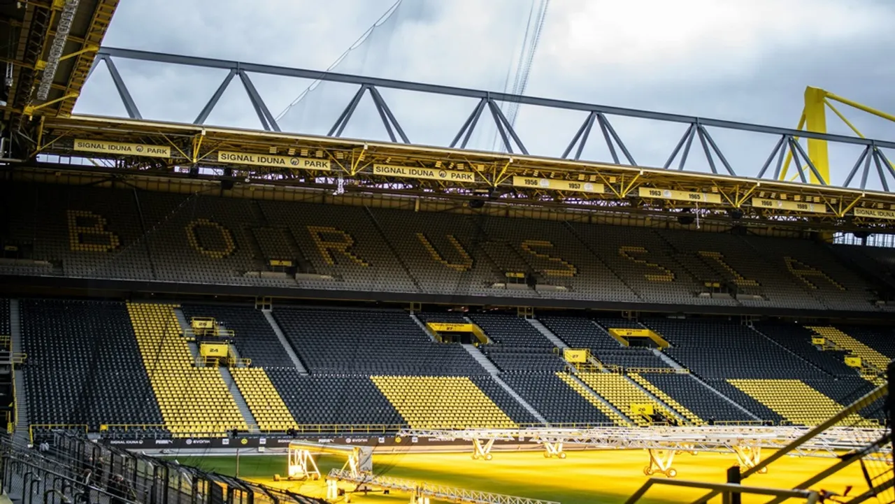 The 4 GWh solar system on SIGNAL IDUNA PARK has sparked debate over balancing climate impact with ethical sourcing. 