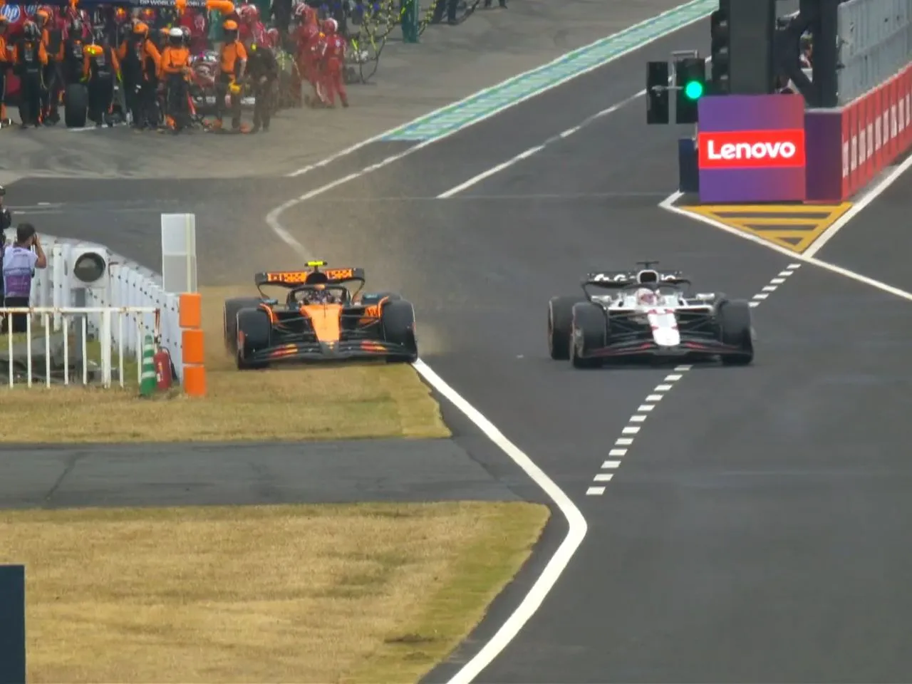 Verstappen and Lando Racing in Pits at 2025 Japanese GP