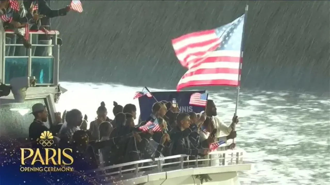 WATCH LeBron James holds USA's flag in pride despite heavy downpour of