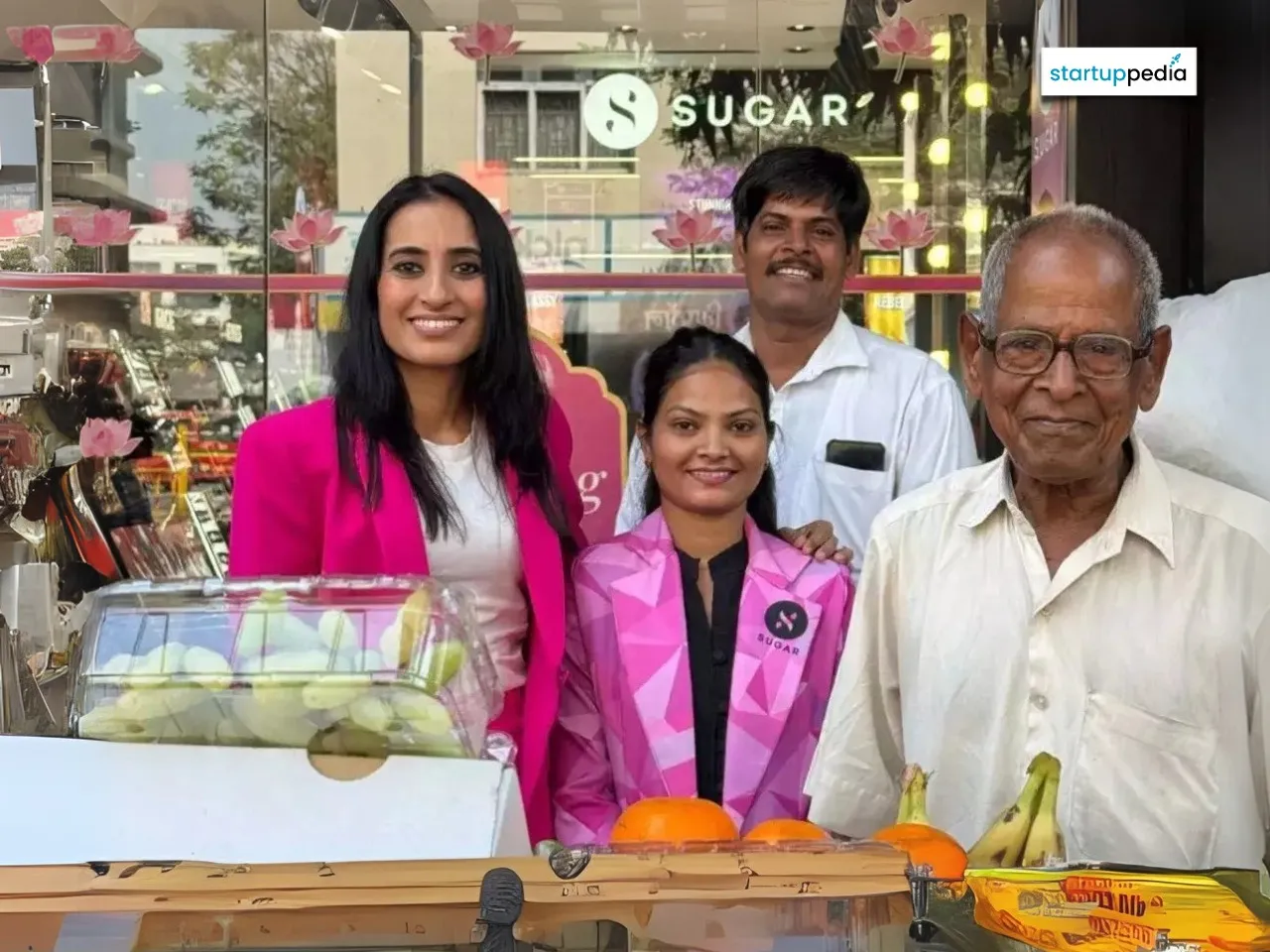 Sugar Cosmetics CEO Vineeta Singh with Employee Megha & Fruit Vendors Suraj & his father outside Sugar's Colaba Causeway Store