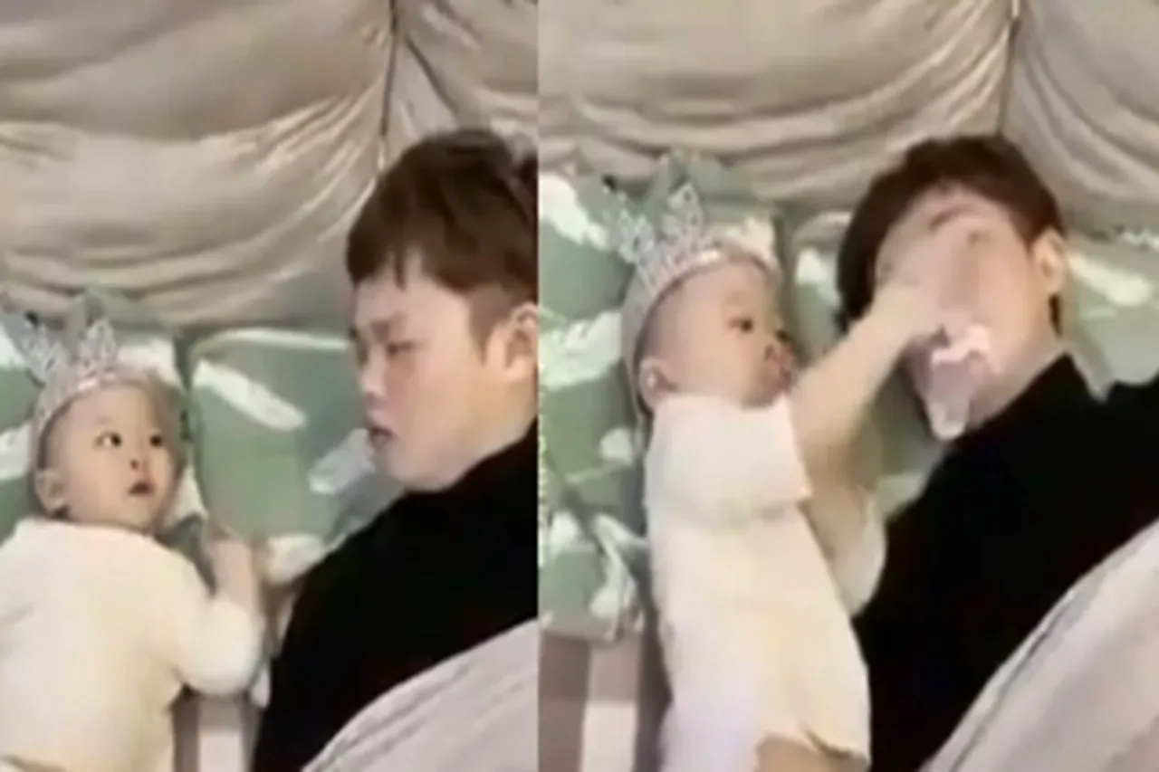 snoring father baby stops viral video - குறட்டை விடும் அப்பாக்களுக்கு இது சமர்ப்பணம்! என்னா மூளை இந்த குழந்தைக்கு!! - வைரல் வீடியோ