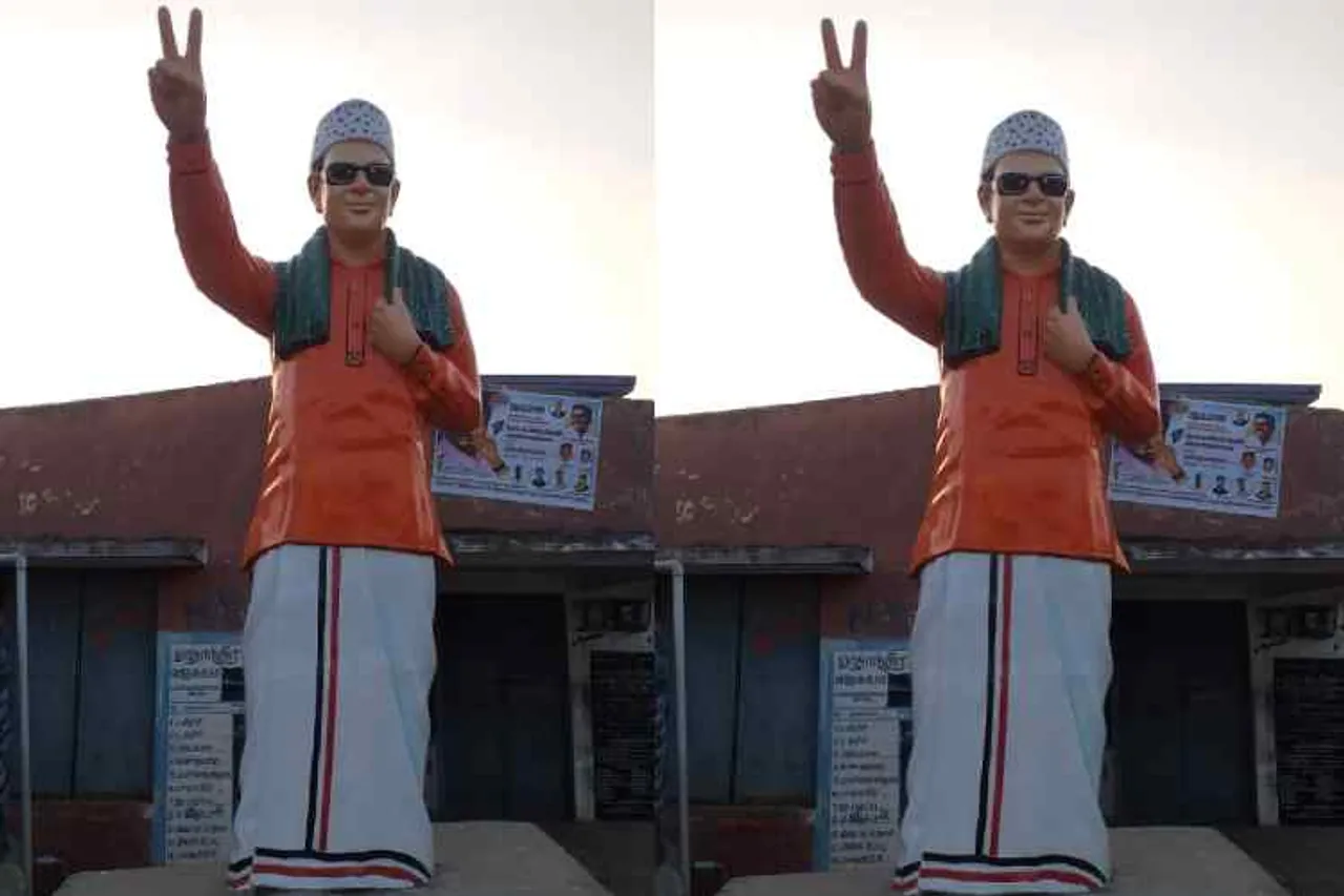 mgr statue shir saffron color, saffron color mgr statue, எம்.ஜி.ஆர் சிலைக்கு காவி நிறம், காவி நிற சட்டை, எம்.ஜி.ஆர் சிலை, திருவண்ணாமலை, thiruvannamalai, kilpennathur, karungalikuppam, aiadmke cadres paintin saffron color mgr