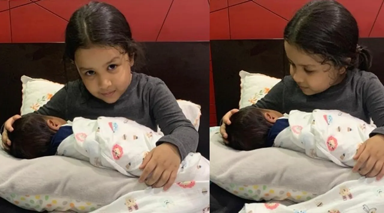 Sakshi Dhoni shares pics of daughter Ziva holding a baby