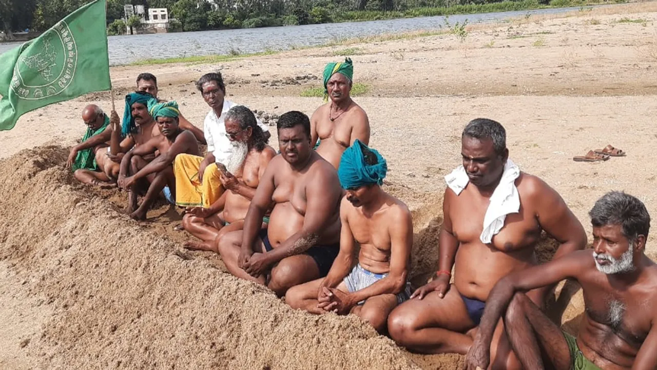 Farmers protest by burying themselves in the soil in Trichy