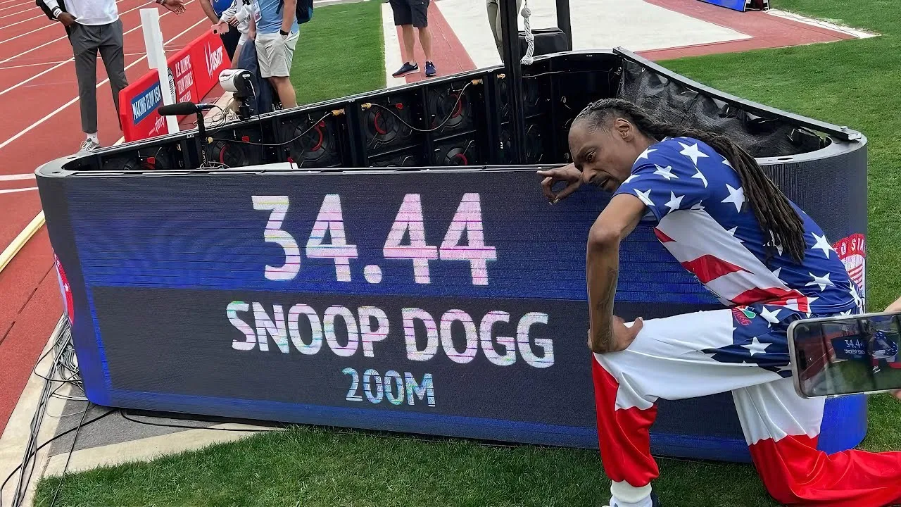 Snoop Dogg participates in the 200-meter dash at the U.S. Olympic Team trials. 