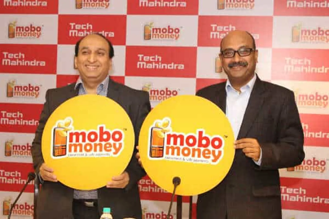 Mr Jagdish MitraChief Strategy Marketing Officer Head of Growth Factories Tech Mahindra Ltd Right unveiling MoboMoney along with Mr Vivek ChandokHead Consumer Businesses Tech Mahindra Ltd