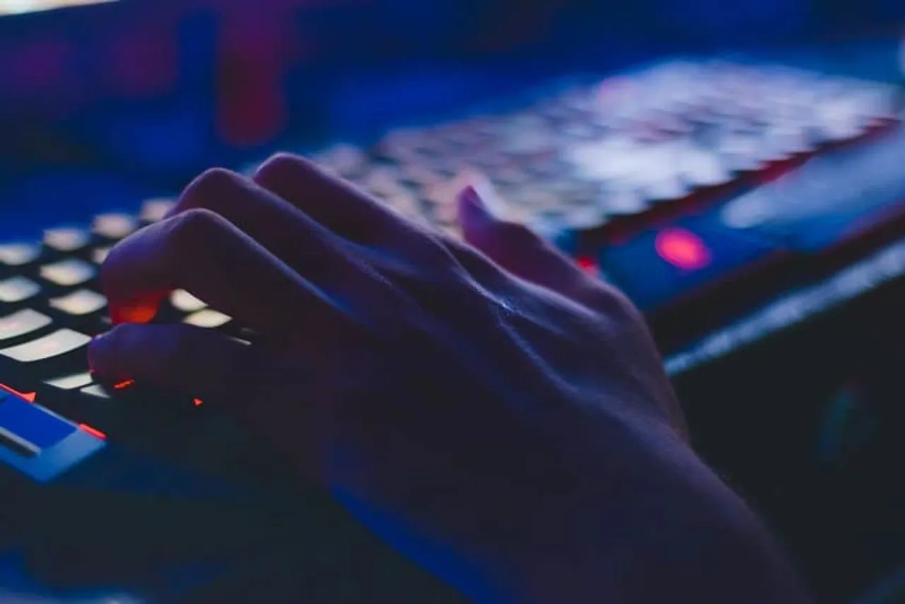 photo of person typing on computer keyboard opt