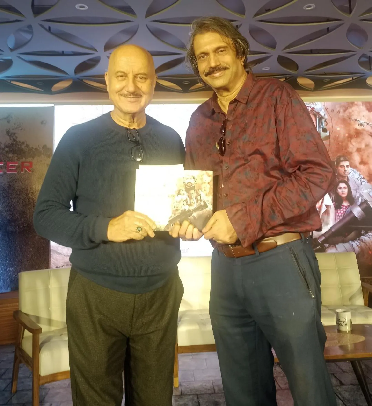Anupam Kher presents The Freelancer  memoirs book to Chaitanya Padukone