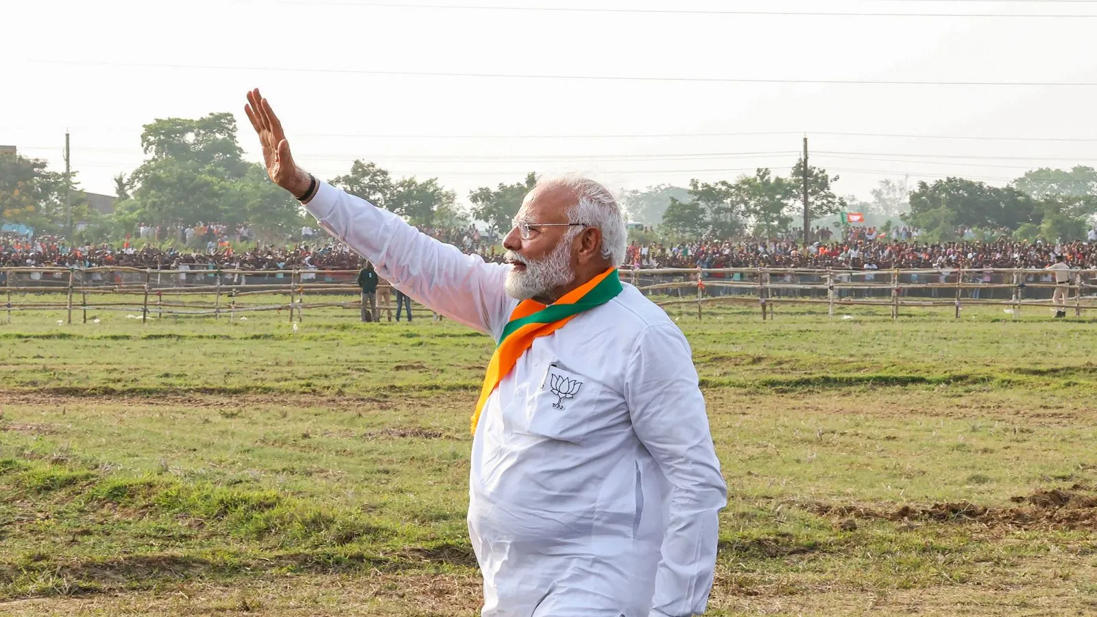 Prime Minister Narendra Modi waves to supporters during a public meeting ahead of the seventh phase of Lok Sabha elections, in Kendrapara district, Wednesday, May 29, 2024