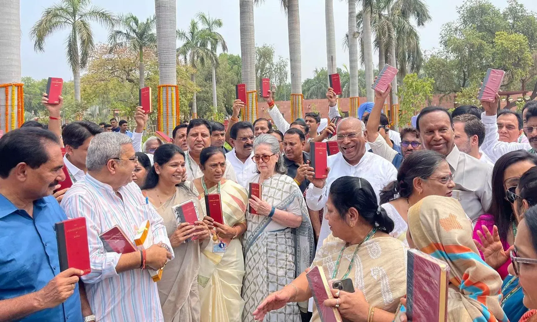 INDIA bloc protests in Parliament holding copies of the Constitution