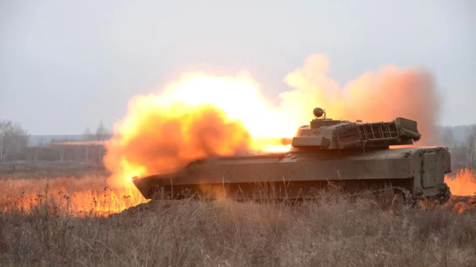 A self-propelled howitzer fires during artillery drills held by the 92nd Separate Mechanized Brigade of the Ukrainian Armed Forces at a shooting range in an unknown location in eastern Ukraine, in this handout picture released December 17, 2021. 