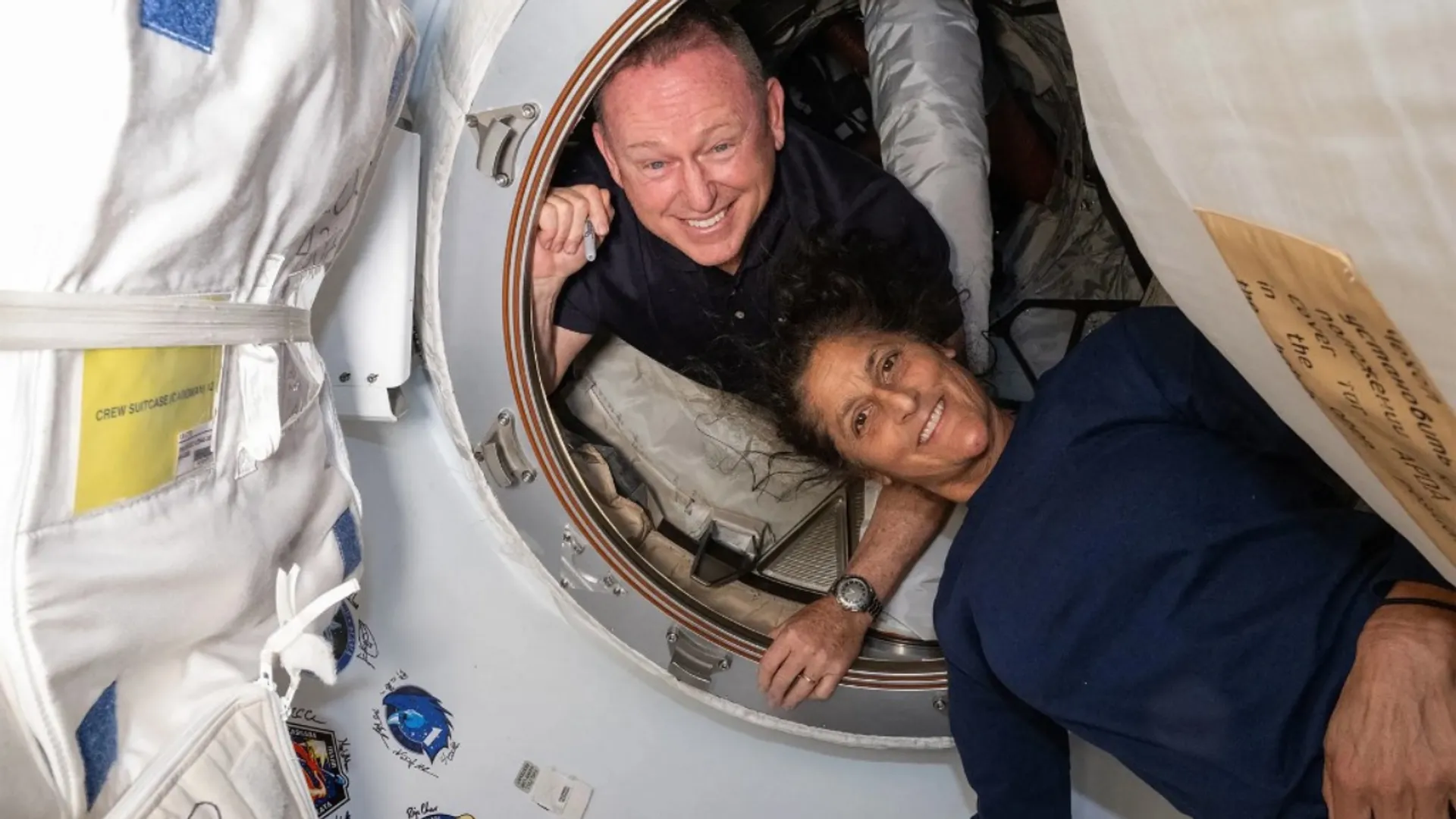 File Photo: This undated handout picture from Nasa released on July2, 2024 shows NASA’s Boeing Crew Flight Test astronauts (from top) Butch Wilmore and Sunita Williams inside the vestibule between the forward port on the International Space Station’s Harmony module and Boeing's Starliner spacecraft. 
