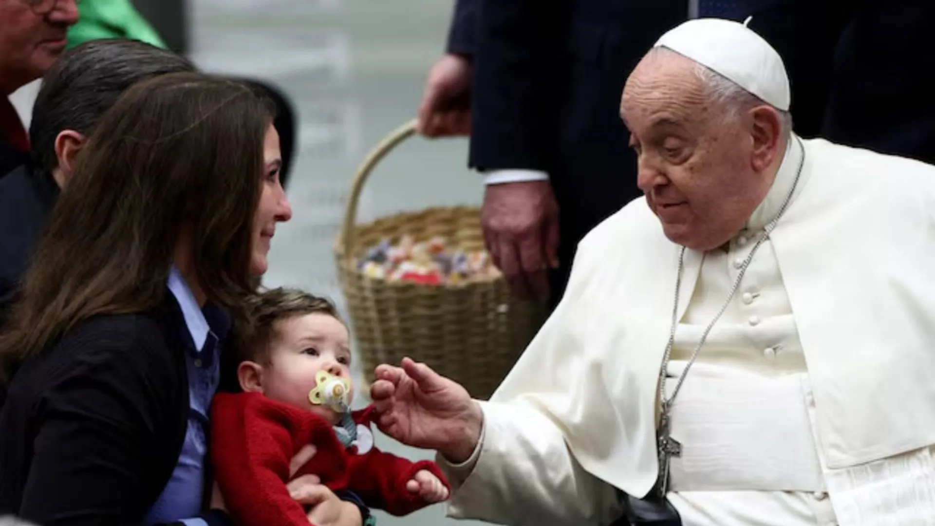 Pope Francis greets a child at the Jubilee audience in Paul VI hall at the Vatican, January 11, 2025. 