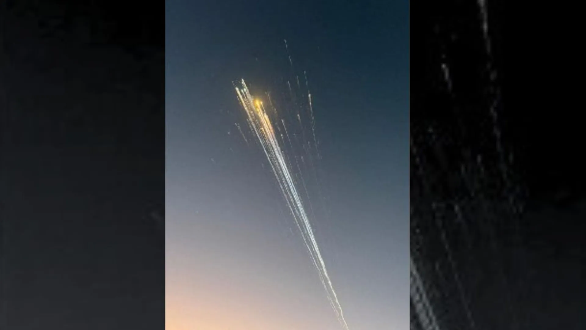 In this handout image courtesy of Greg Blee, debris from the SpaceX Starship is seen in the sky near Providenciales, Turks