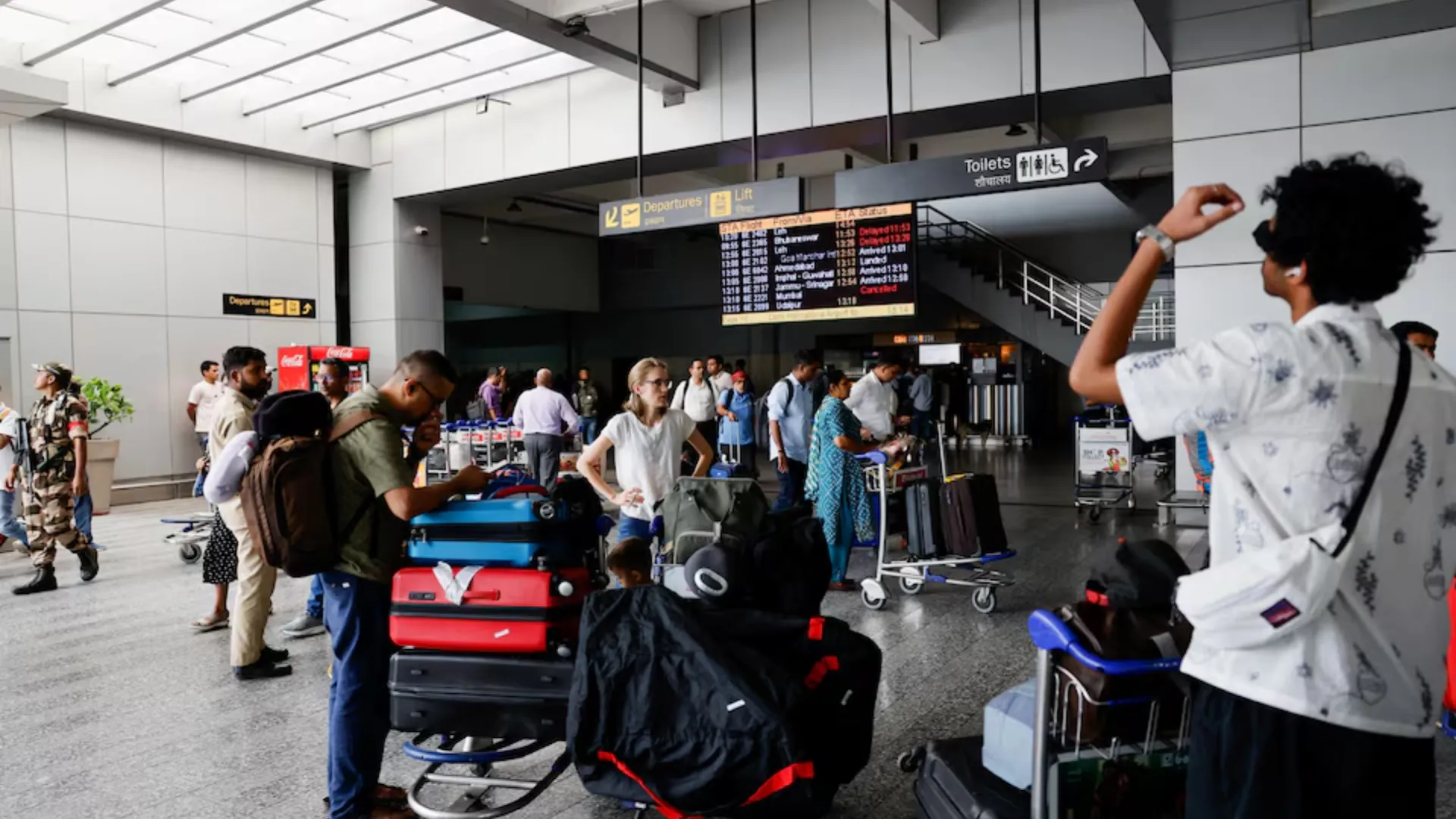 Passengers wait at Terminal 2 of Indira Gandhi International Airport in New Delhi, India, July 1, 2024.