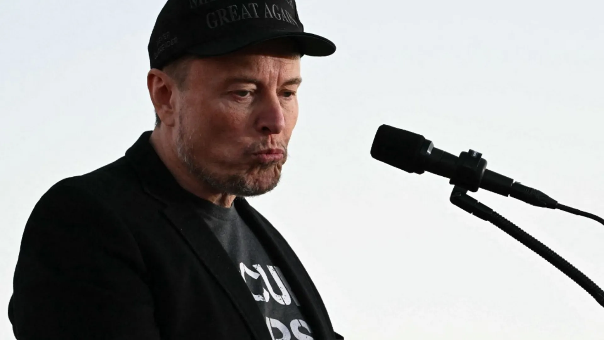 File Photo: Tesla CEO Elon Musk speaks on stage during a campaign rally with former US President and Republican presidential candidate Donald Trump at site of his first assassination attempt in Butler, Pennsylvania on October 5, 2024.