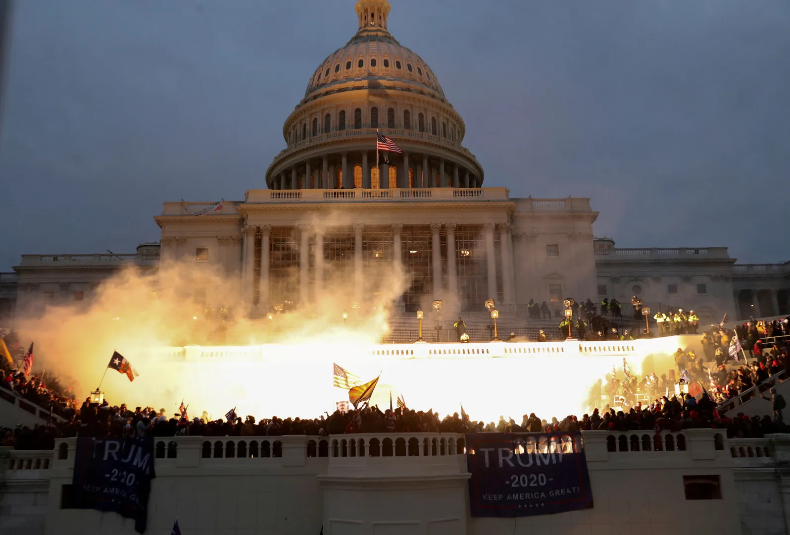 An explosion caused by a police munition is seen while supporters of US President Donald Trump gather in front of the US Capitol Building in Washington, US, January 6, 2021. 
