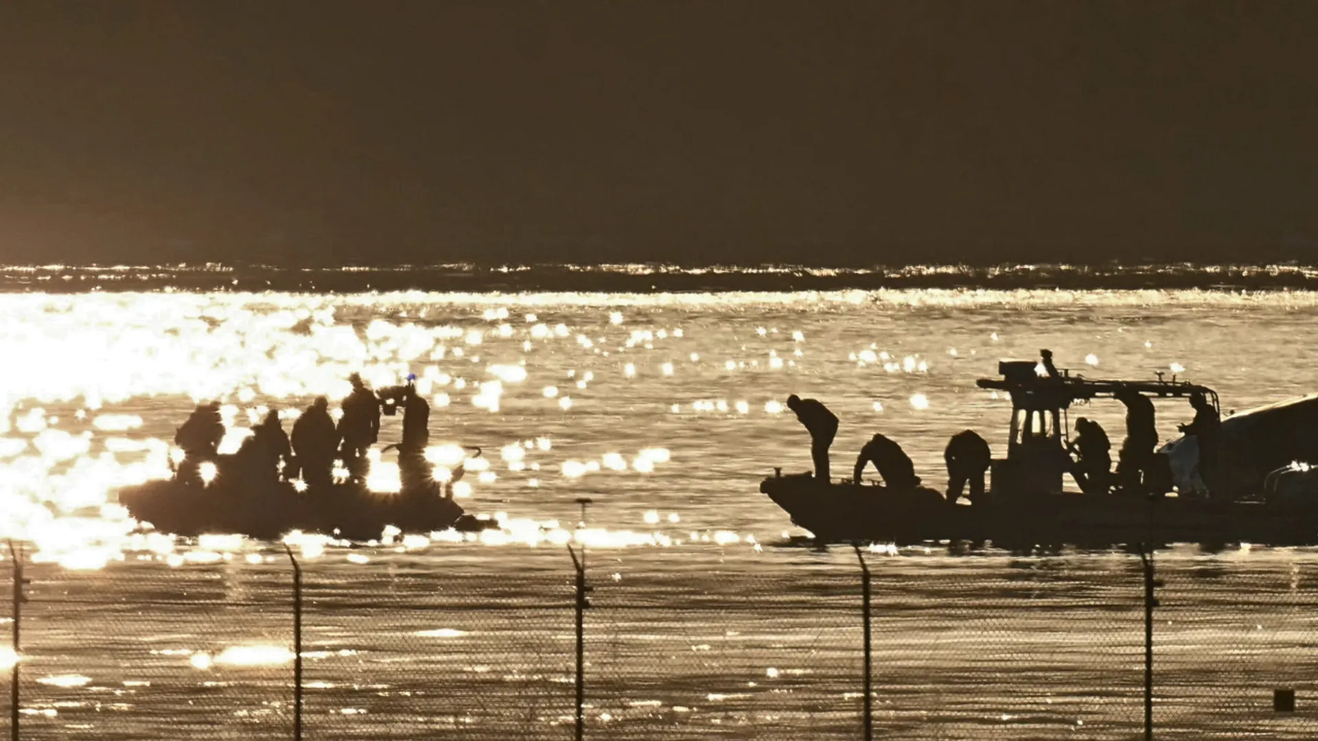 Part of the wreckage is seen as rescue crews search the waters of the Potomac River after American Airlines flight 5342 on approach to Reagan National Airport crashed into the river after colliding with a US Army helicopter, near Washington, DC