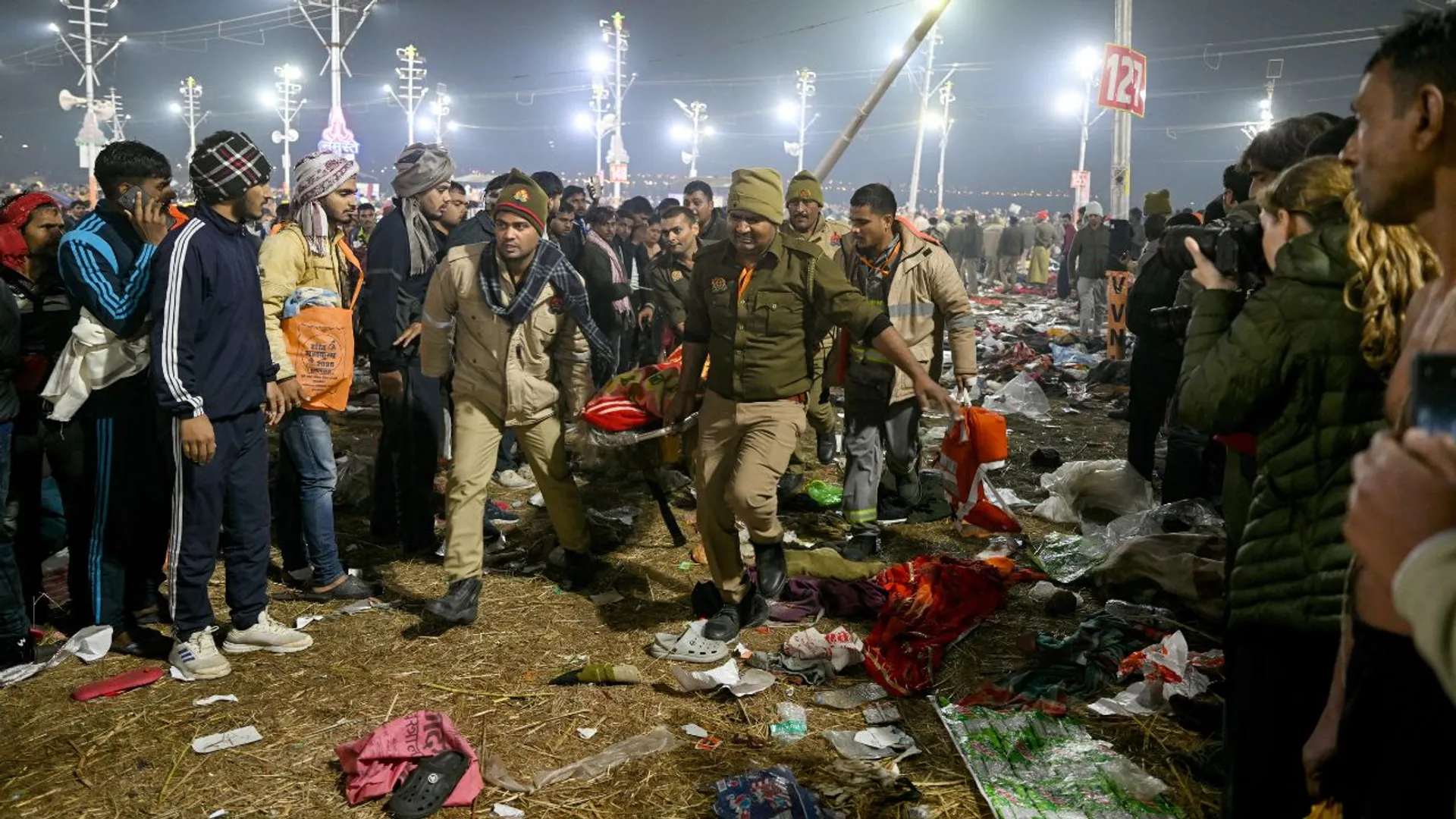 Hindu pilgrims and family members of victims gather at the site of a stampede, during the Maha Kumbh Mela festival in Prayagraj on January 29, 2025.