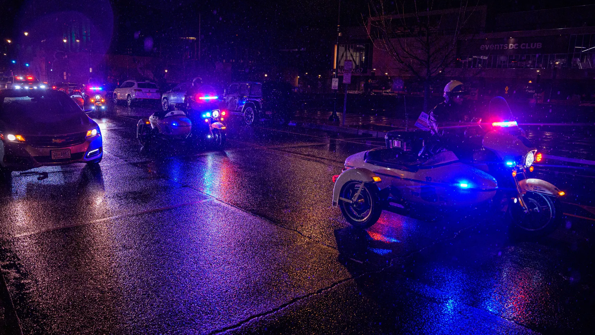 Representative Image: Police officers lead a motorcade for two ambulances