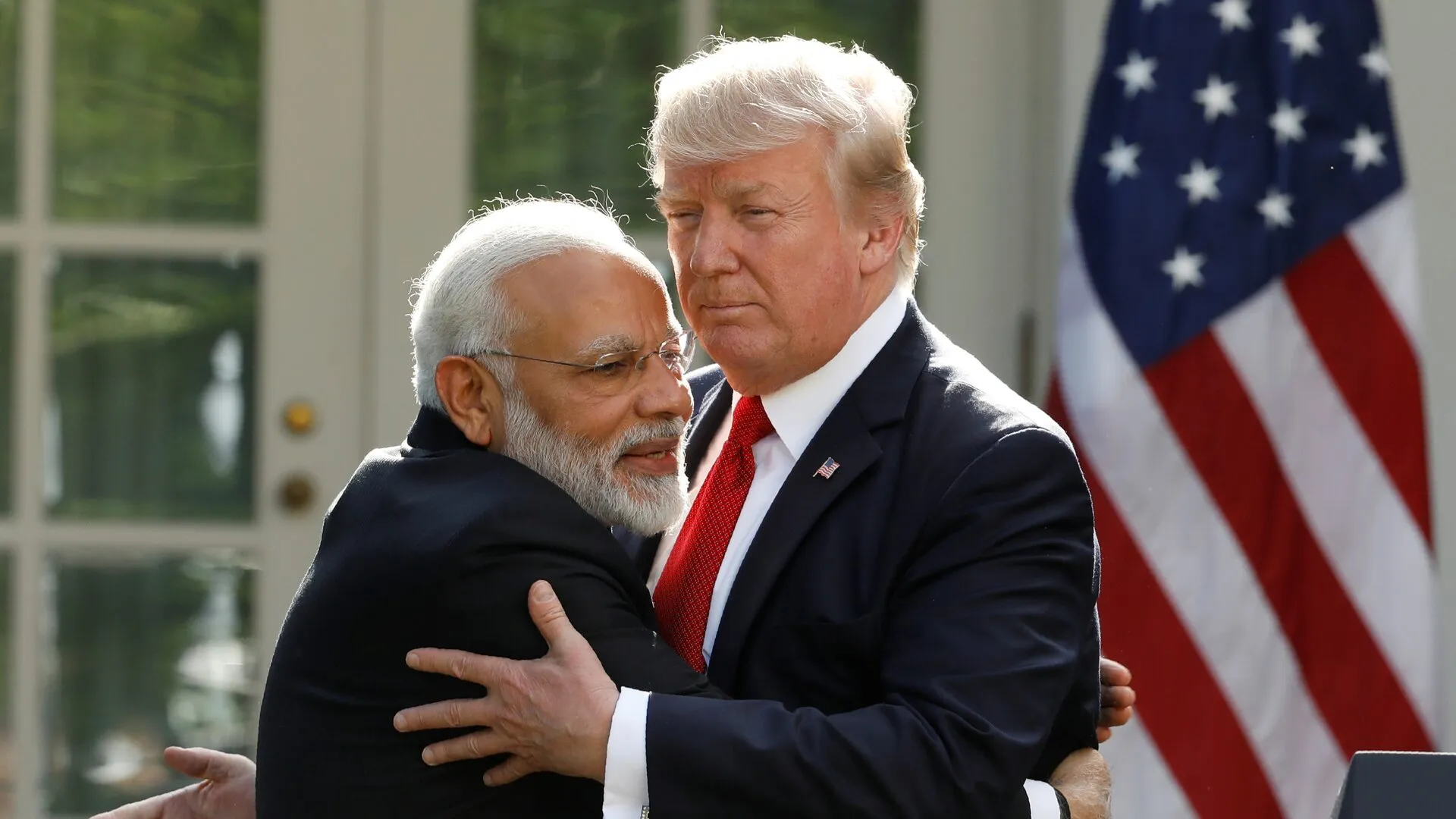 India's Prime Minister Narendra Modi hugs U.S. President Donald Trump
