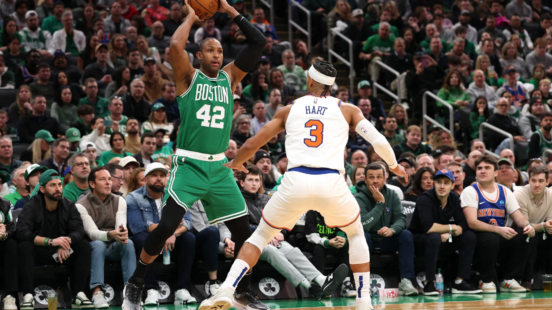 Al Horford of the Boston Celtics looks for a pass over Josh Hart of the New York Knicks during their game in Boston, Massachusetts