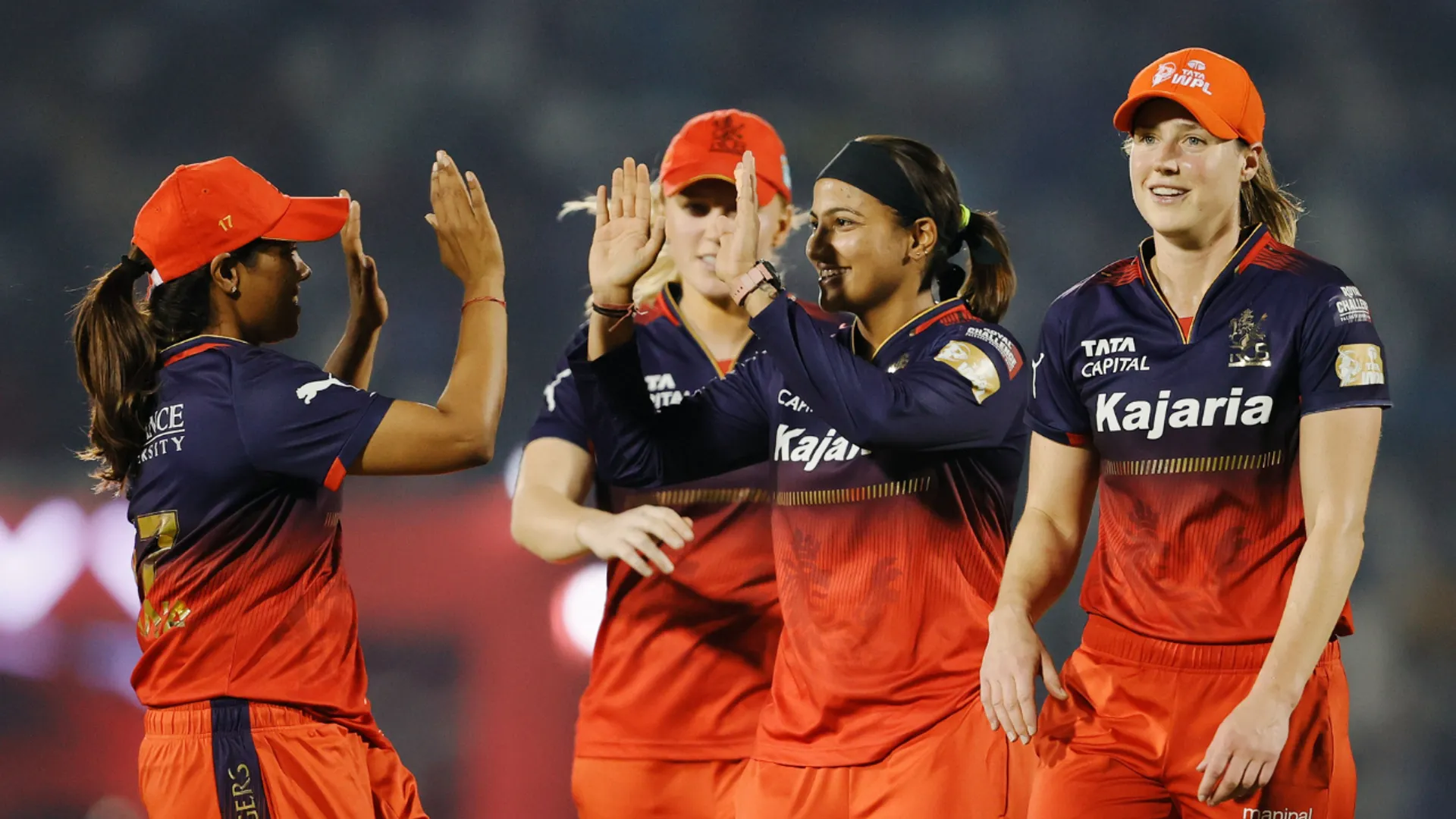 RCB players celebrate a wicket