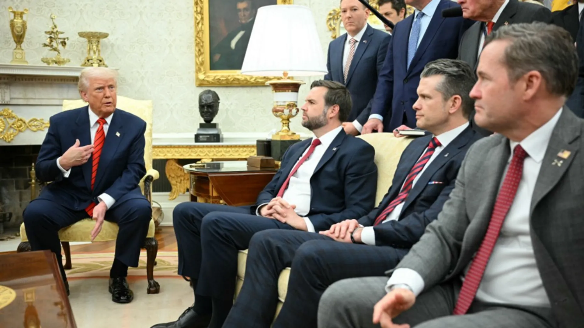 US President Donald Trump speaks to the press as he meets with NATO Secretary General Mark Rutte in the Oval Office of the White House in Washington, DC, on March 13, 2025 as, seated from L to R, Vice Presient JD Vance, Defense Secretary Pete Hegseth and National Security Advisor Mike Waltz, and standing, special envoy to Ukraine and Russia Keith Kellog (R) and NATO ambassador nominee Matthew Whitaker (C) look on