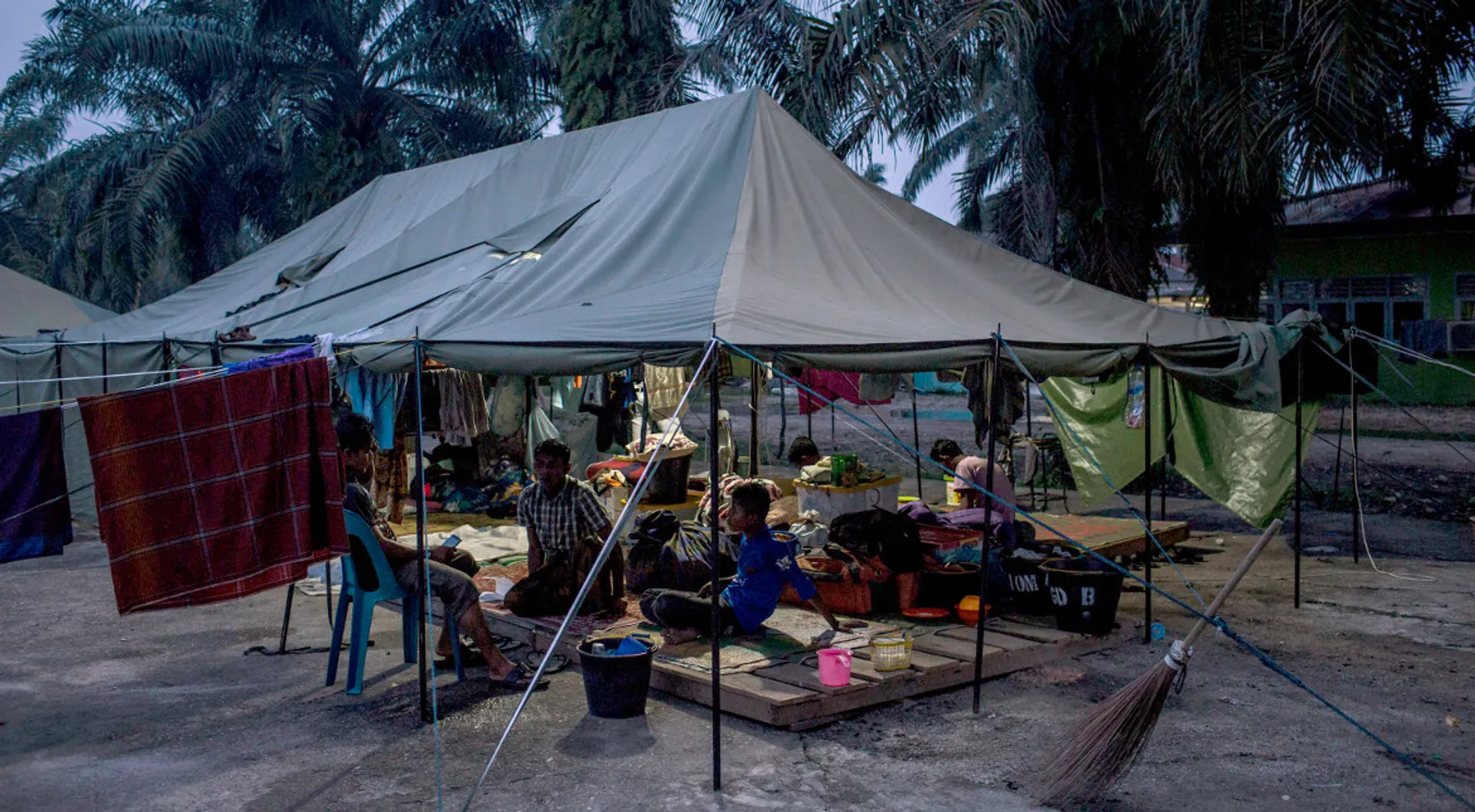 Migrants in Indonesia stranded for days on boat finally brought ashore