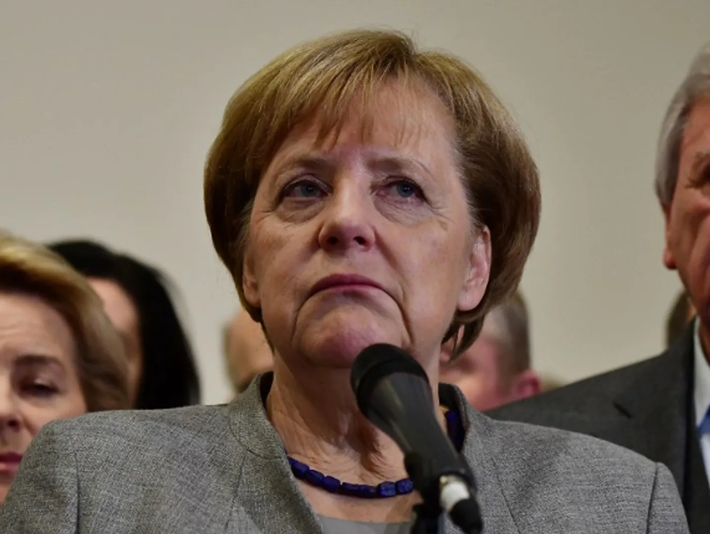 Race on as Merkel opens path for succession