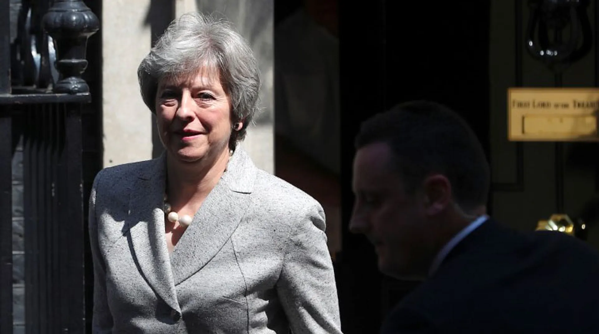 British PM Theresa May hails Brexit deal but her MPs say it threatens UK's unity