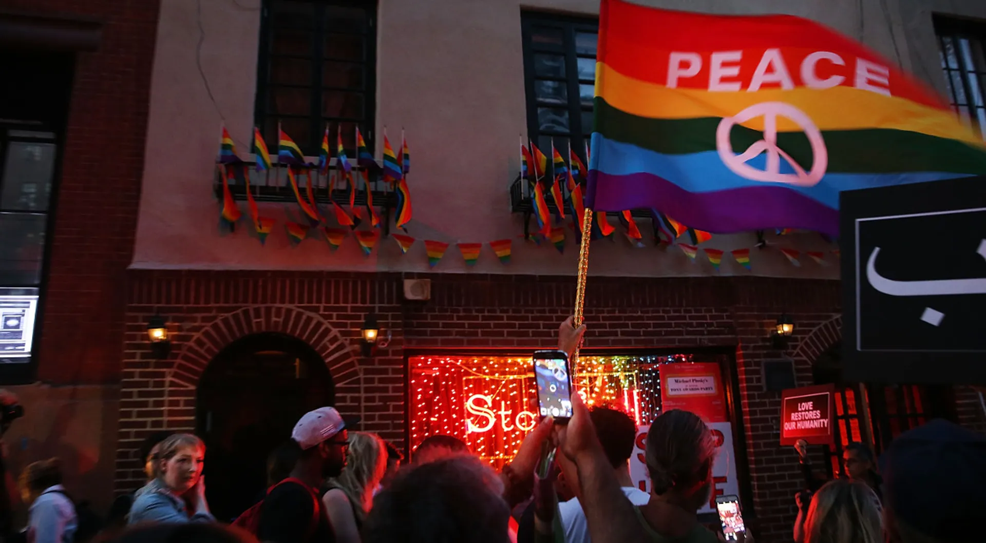 Thousands take to Paris streets to honour Orlando shooting victims