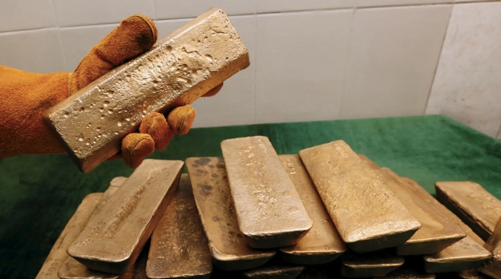 Gold hits two-month peak on dollar weakness, US strikes