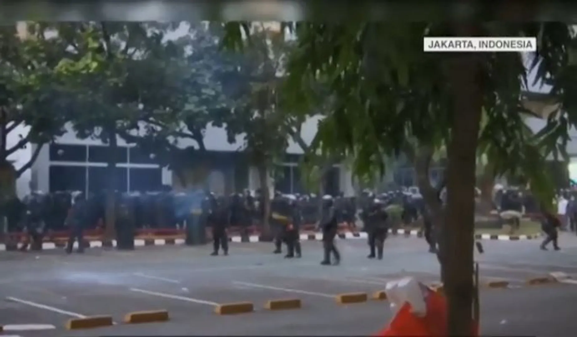 Indonesian police fire tear gas to break up anti-graft, sex-ban law protests