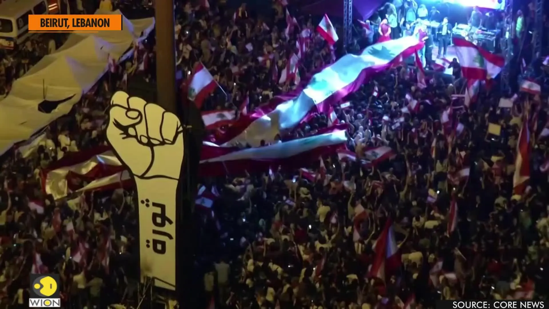 Lebanese protesters wave flags, raise fortitude